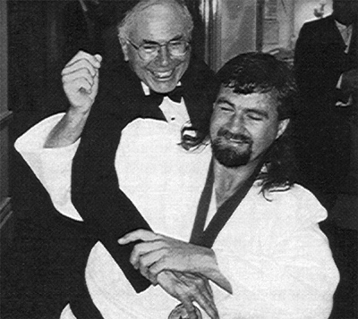 Anthony Clarke throws John Howard